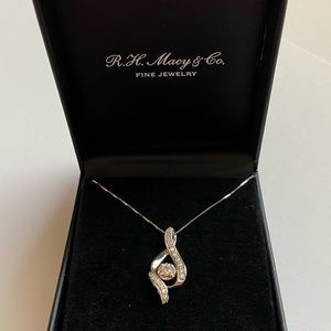 14k white gold and 3/8 carat diamond ribbon pendant w/ a 10k white gold chain